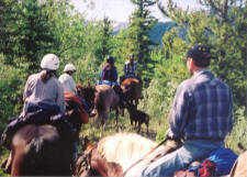 A group heading down the trail behind the ranch.