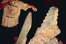 A sculpture of a sting ray spine, used in Mayan ceremonies, inside Actun Tunichil Muknal.